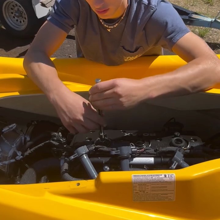 An oil change underway on a Sea-Doo RXP-X